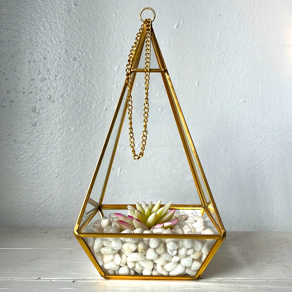 Golden metal frame, glass casing